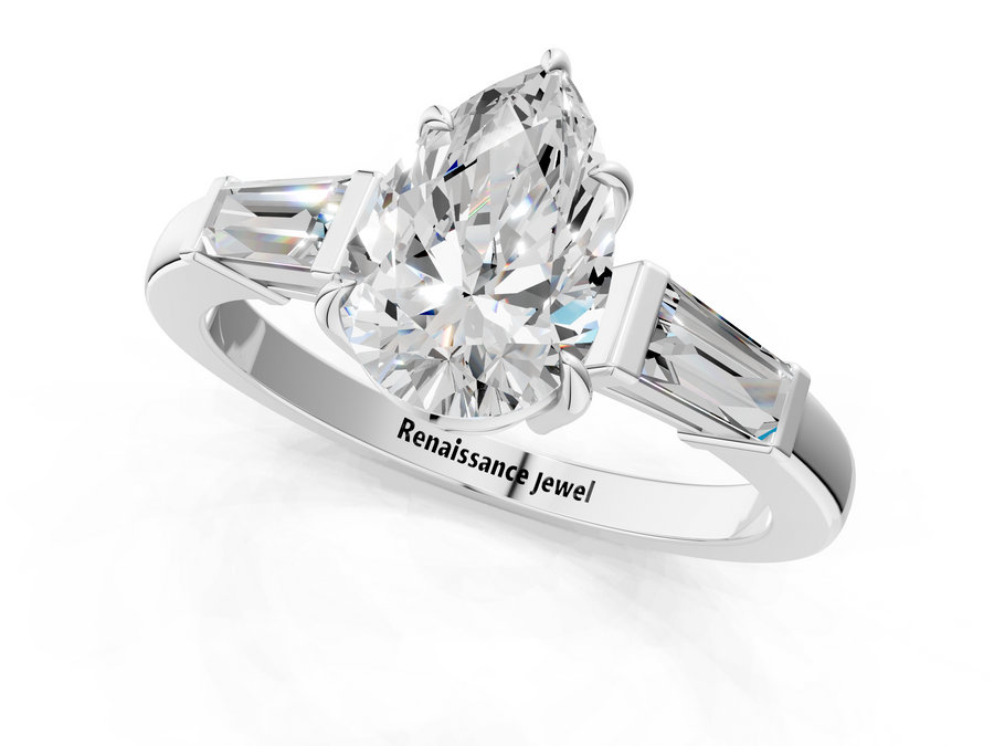 White gold Pear Cut Diamond Ring with Tapered Baguette Side Stones in Four-Prong Setting