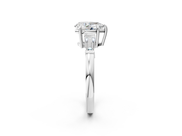 White gold Pear Cut Diamond Ring with Tapered Baguette Side Stones in Four-Prong Setting
