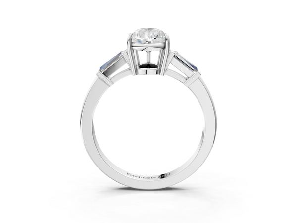White gold Pear Cut Diamond Ring with Tapered Baguette Side Stones in Four-Prong Setting