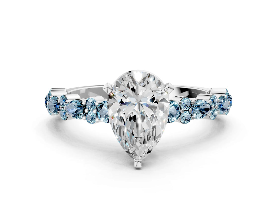 White gold Pear Cut Diamond Side Stone Solitaire Ring with Round with Aquamarine side stone and Four-Prong Setting