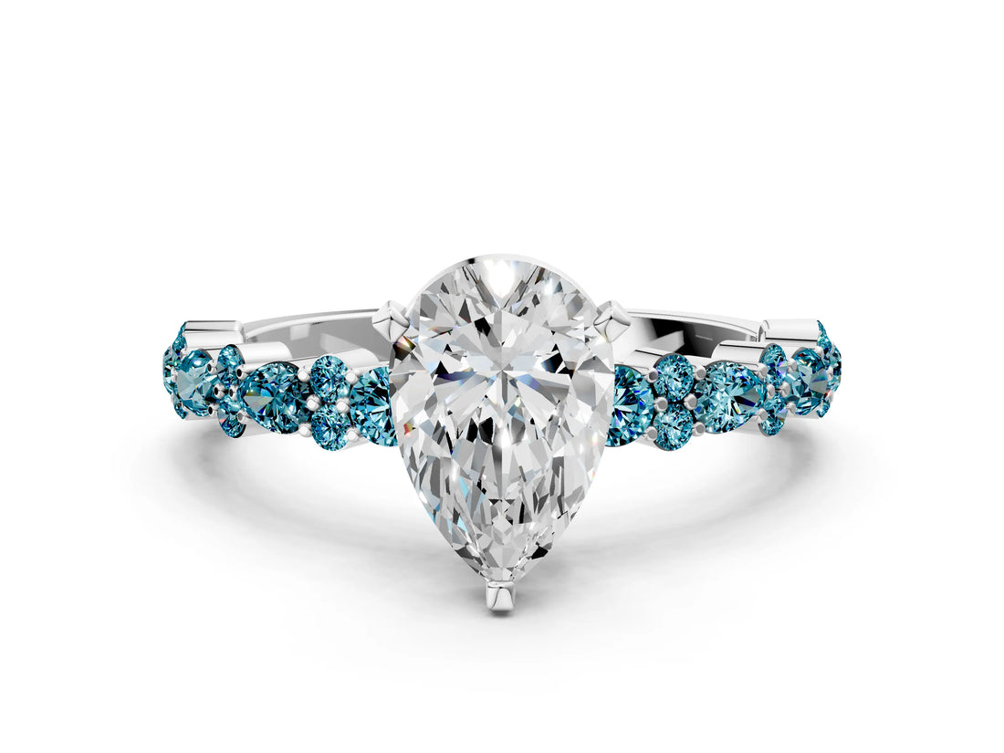 White gold Pear Cut Diamond Side Stone Solitaire Ring with Round with Blue Topaz side stone and Four-Prong Setting