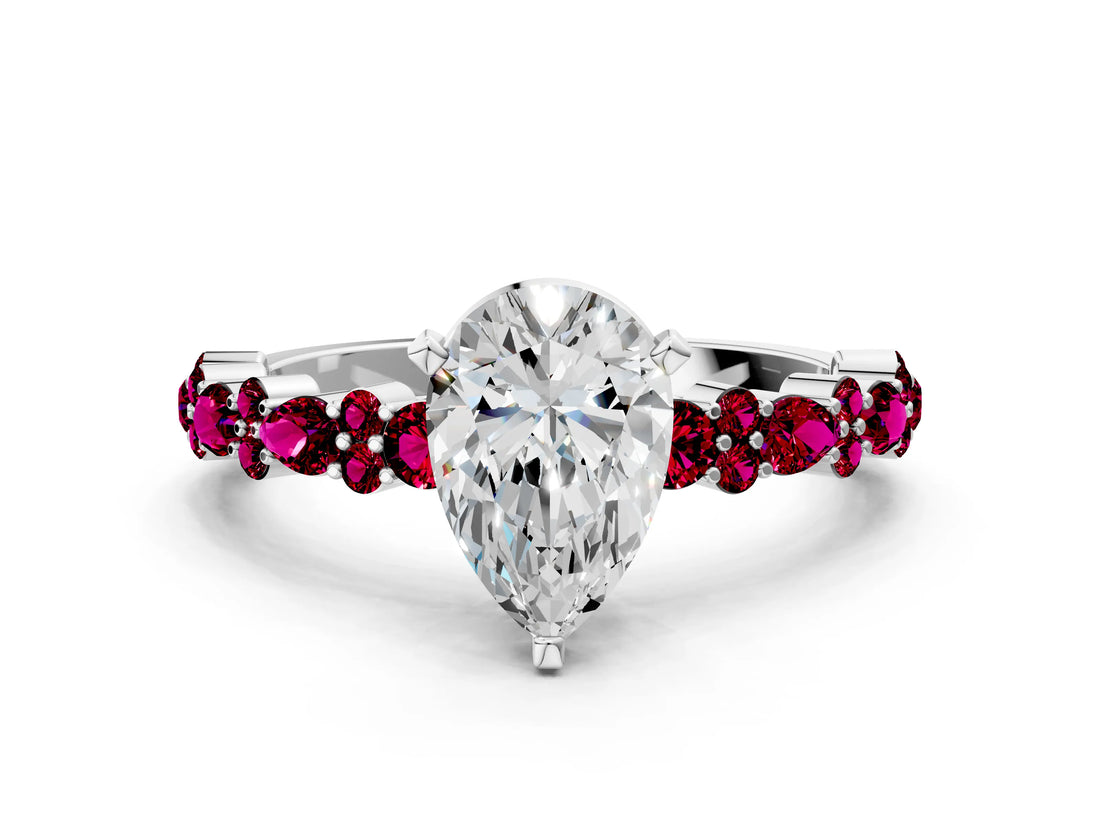 White gold Pear Cut Diamond Side Stone Solitaire Ring with Round with Garnet side stone and Four-Prong Setting
