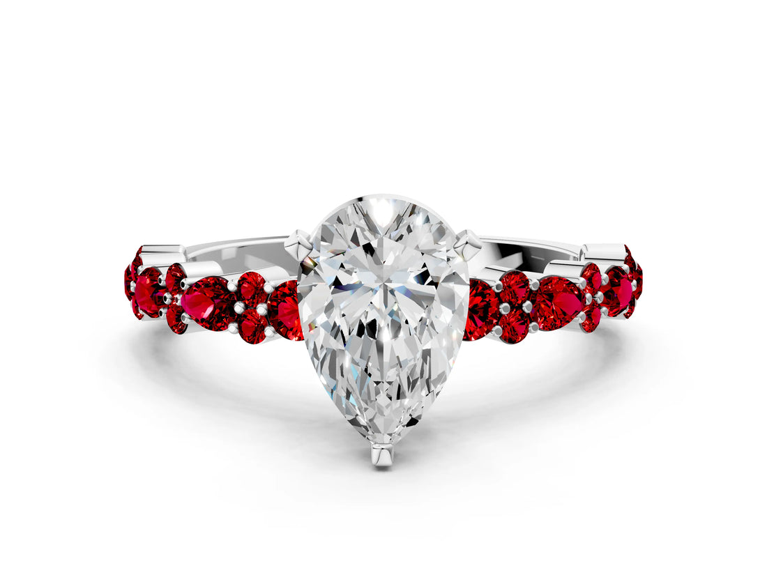 White gold Pear Cut Diamond Side Stone Solitaire Ring with Round with Ruby side stone and Four-Prong Setting