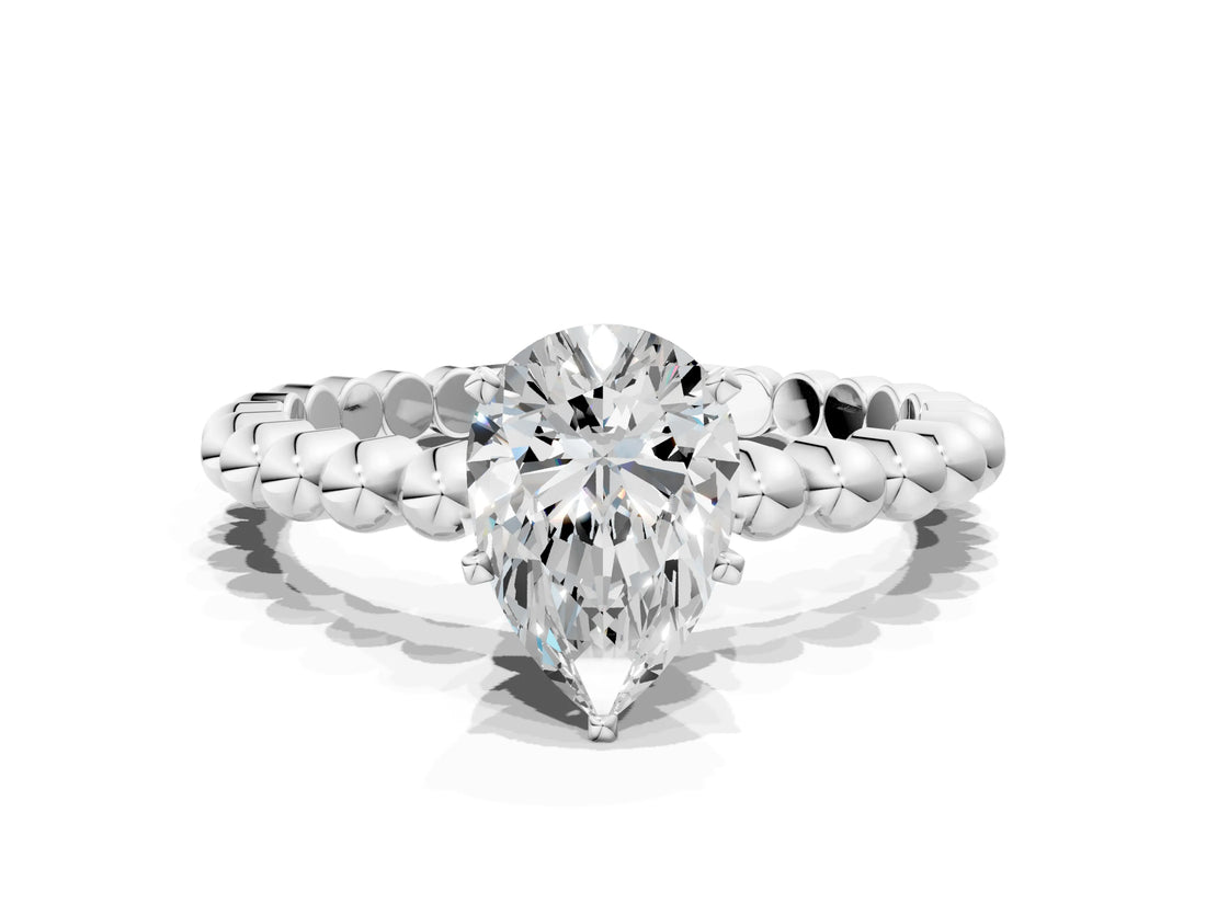 White gold Pear Cut Diamond Solitaire Ring with Beaded Band and Prong Setting_313