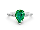 White gold Pear Cut Diamond Solitaire Ring with Four-Prong Setting and Pavé Band