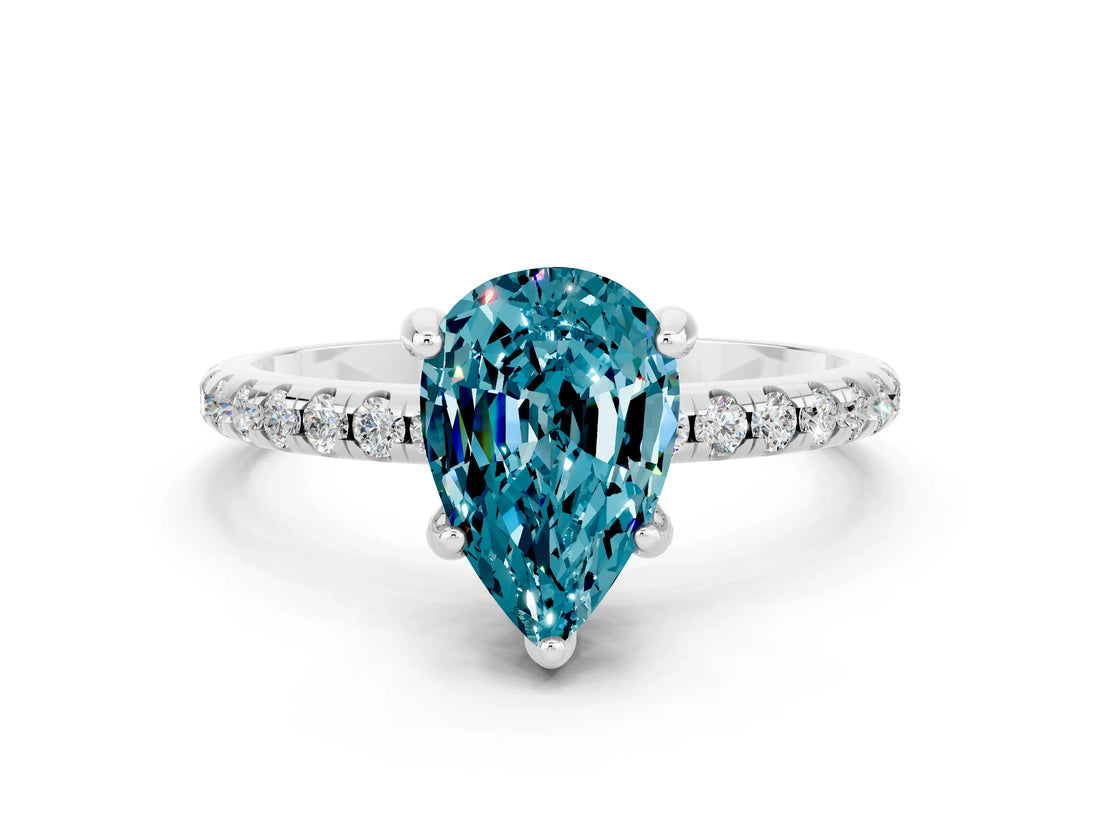 White gold Pear Cut Diamond Solitaire Ring with Four-Prong Setting and Pavé Band