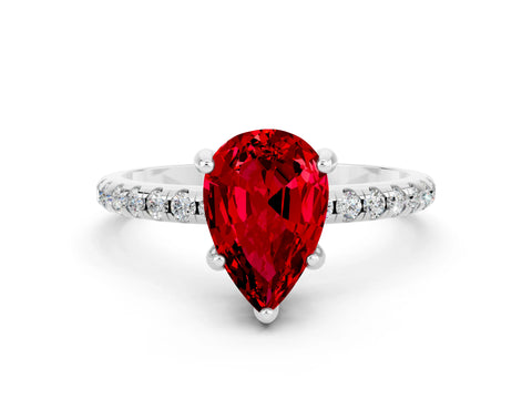 White gold Pear Cut Diamond Solitaire Ring with Four-Prong Setting and Pavé Band