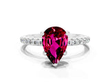 White gold Pear Cut Diamond Solitaire Ring with Four-Prong Setting and Pavé Band