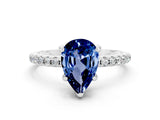 White gold Pear Cut Diamond Solitaire Ring with Four-Prong Setting and Pavé Band