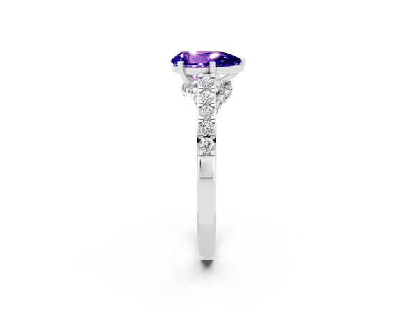 Platinum Pear Cut Tanzanite Solitaire Ring with Crossover Gallery and Round  Pavé Band