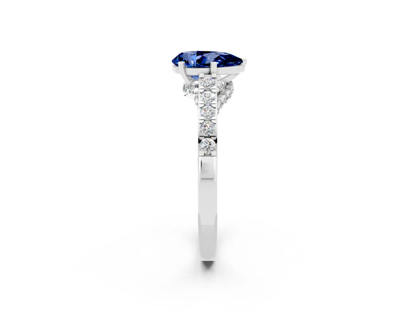 Silver Pear Cut Blue Sapphire Solitaire Ring with Crossover Gallery and Round  Pavé Band