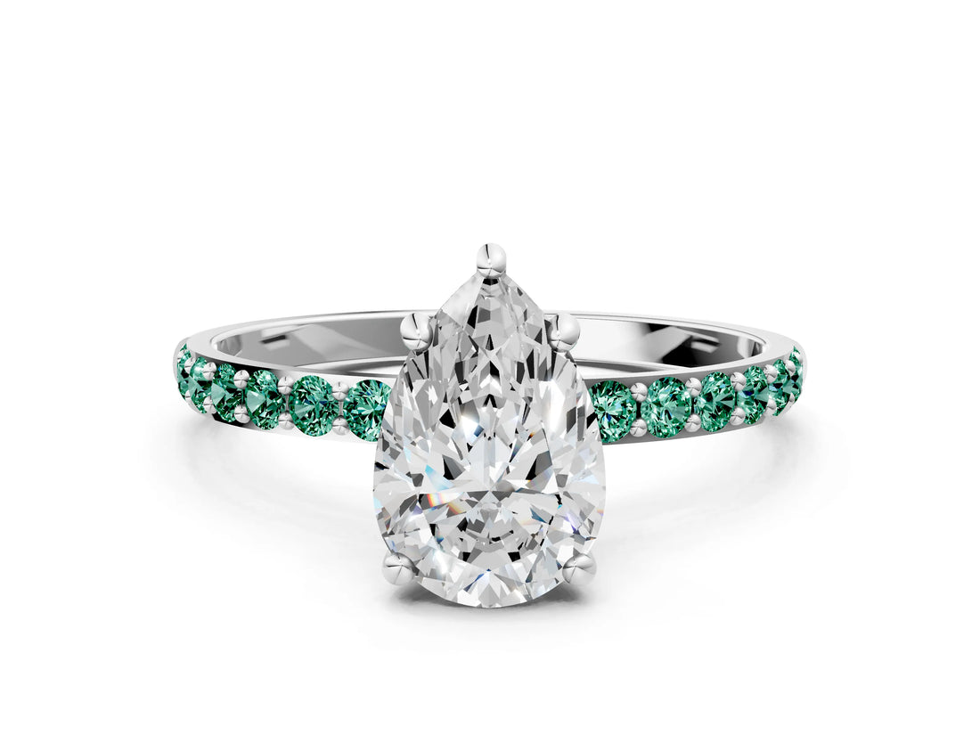 White gold Pear Cut Diamond Solitaire Ring with Round with Green Sapphire side stone Pavé Band and Prong Setting