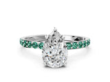 White gold Pear Cut Diamond Solitaire Ring with Round with Green Sapphire side stone Pavé Band and Prong Setting