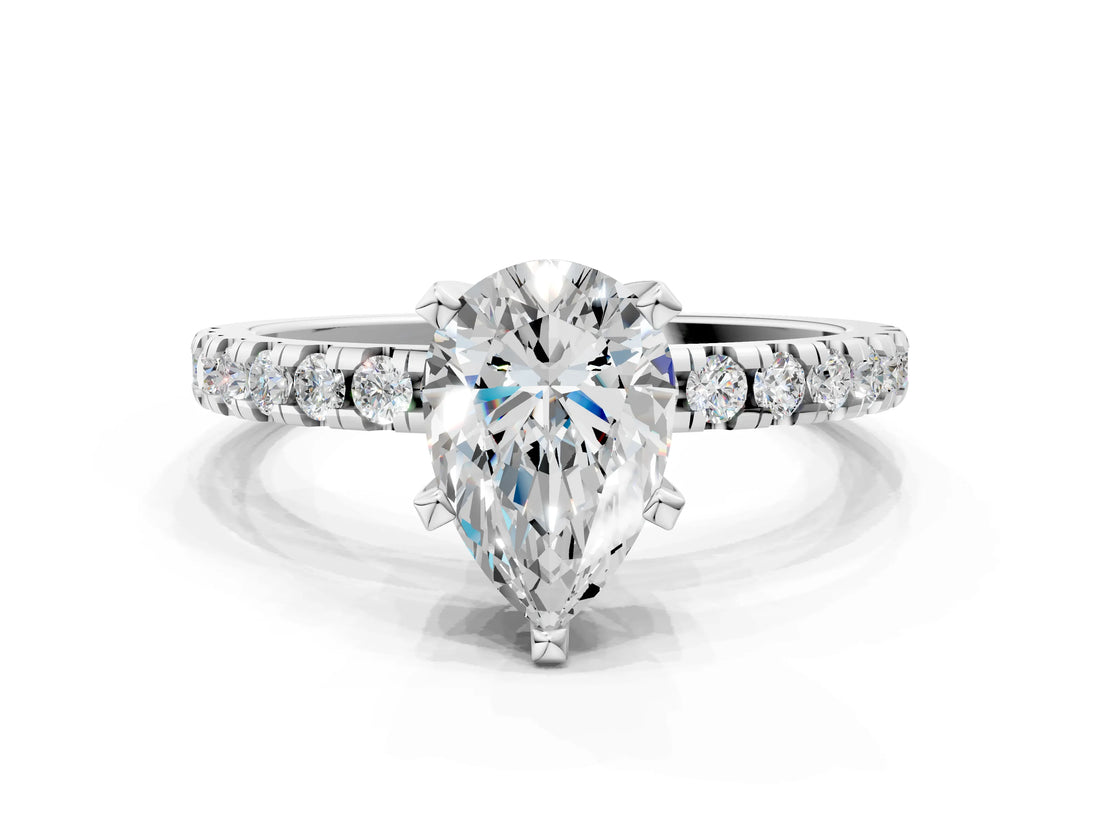 White gold Pear Cut Diamond Solitaire Ring with Round with Moissanite side stone Pavé Band and Four-Prong Setting
