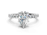 White gold Pear Cut Diamond Solitaire Ring with Round with Moissanite side stone Pavé Band and Four-Prong Setting