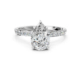 White gold Pear Cut Diamond Solitaire Ring with Round with Moissanite side stone Pavé Band and Prong Setting_12