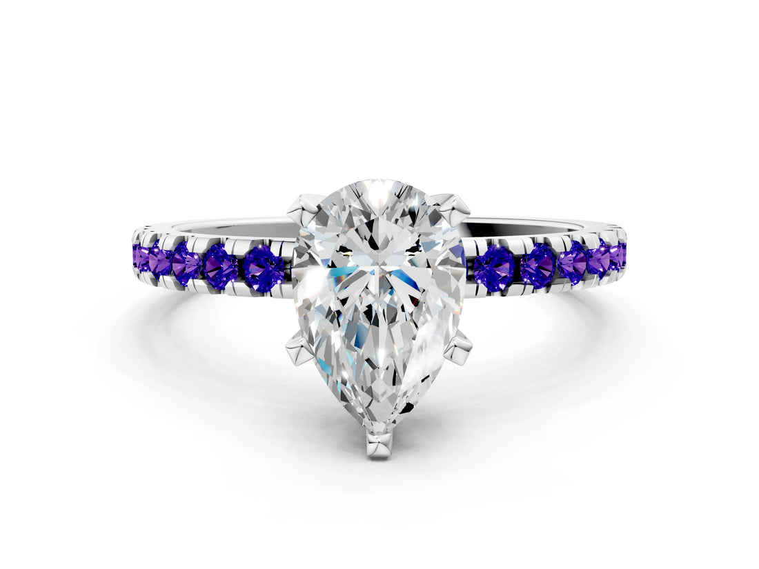White gold Pear Cut Diamond Solitaire Ring with Round with Tanzanite side stone Pavé Band and Four-Prong Setting