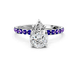 White gold Pear Cut Diamond Solitaire Ring with Round with Tanzanite side stone Pavé Band and Prong Setting