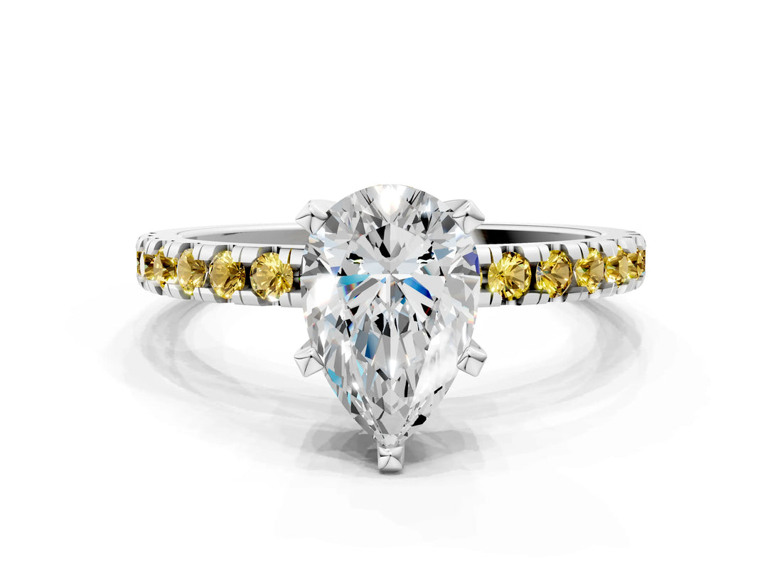 White gold Pear Cut Diamond Solitaire Ring with Round with Yellow Sapphire side stone Pavé Band and Four-Prong Setting