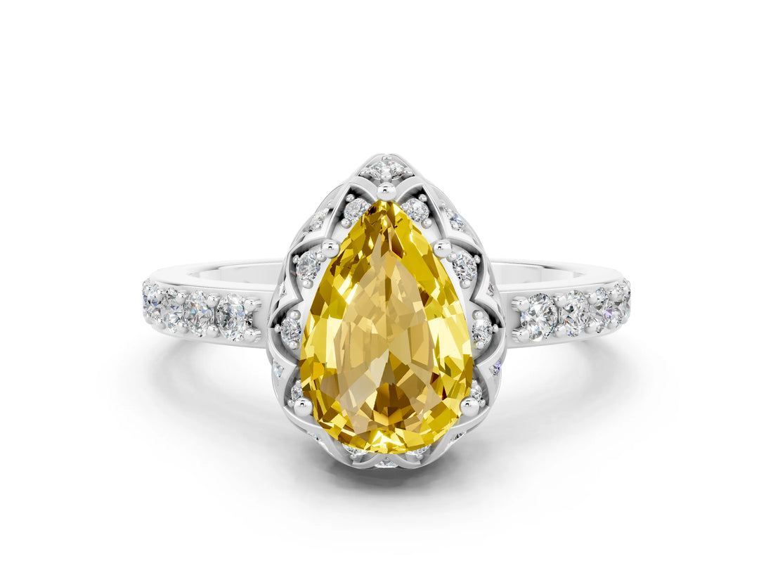 White gold Pear Cut Diamond Solitaire Ring with Shared Prong Pavé Band