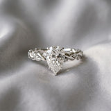 White gold Pear Cut Diamond Solitaire Ring with Twisted Band and Pavé Accents_60