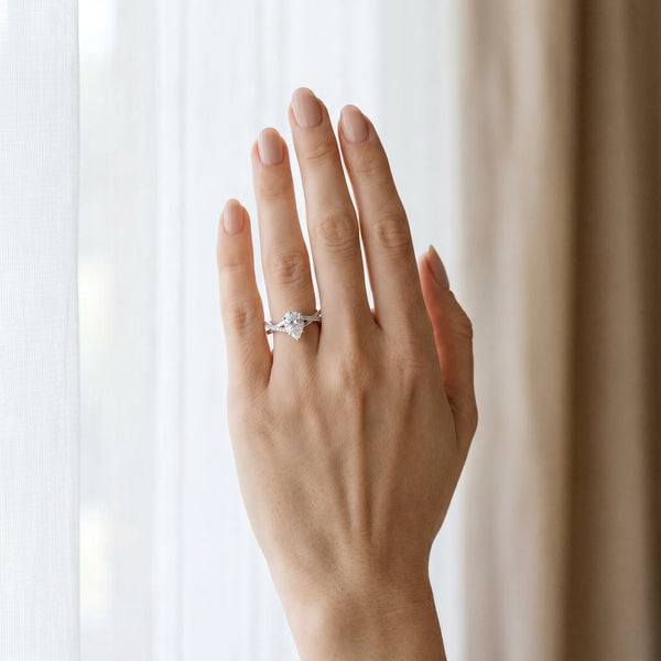 White gold Pear Cut Diamond Twisted Band with Pavé Setting and Four-Prong Setting
