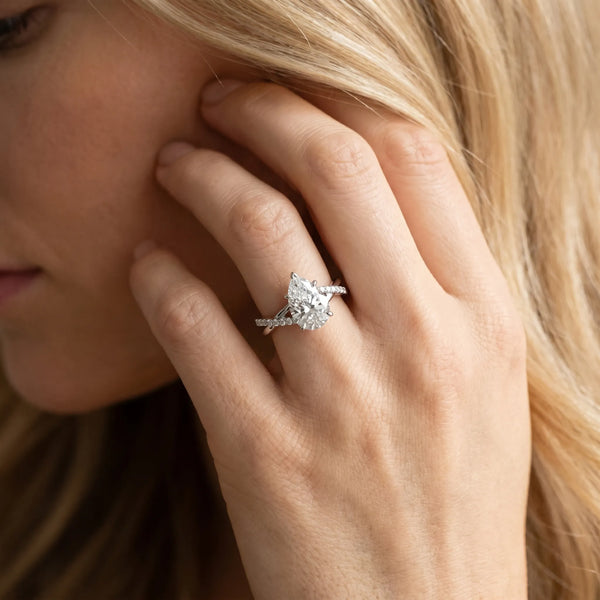 White gold Pear Cut Diamond Twisted Band with Pavé Setting and Four-Prong Setting