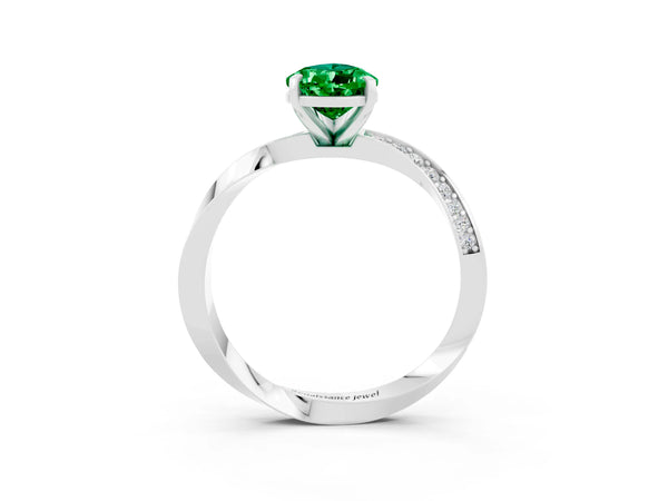 Platinum Pear Cut Emerald Engagement Ring with Side Stone Accents and Four-Prong Setting