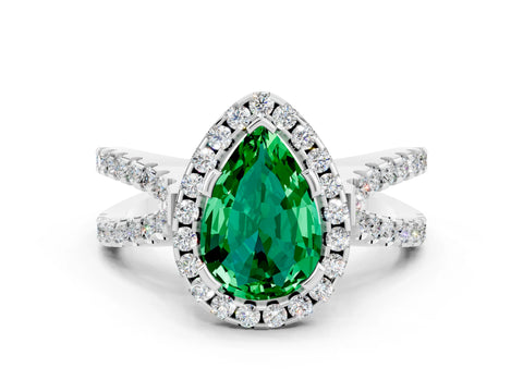 White gold Pear Cut Emerald Halo Ring with Split Shank Pavé Band and Prong Setting