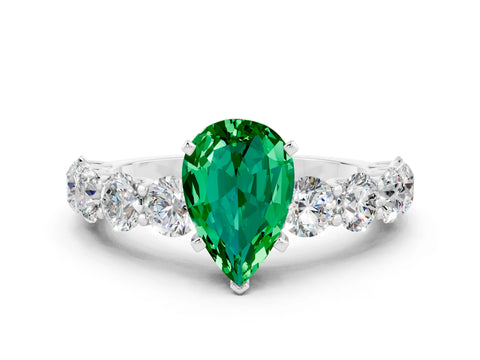 White gold Pear Cut Emerald Prong Setting with Side Stones on a Pave Band