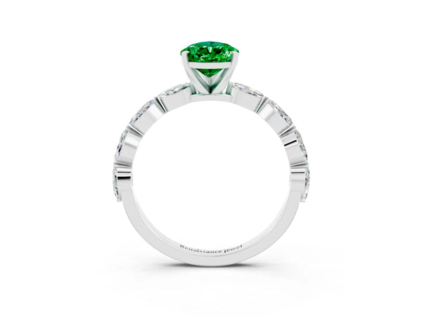 Platinum Pear Cut Emerald Ring with Marquise Side Stones and Prong Setting