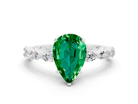 White gold Pear Cut Emerald Ring with Marquise Side Stones and Prong Setting