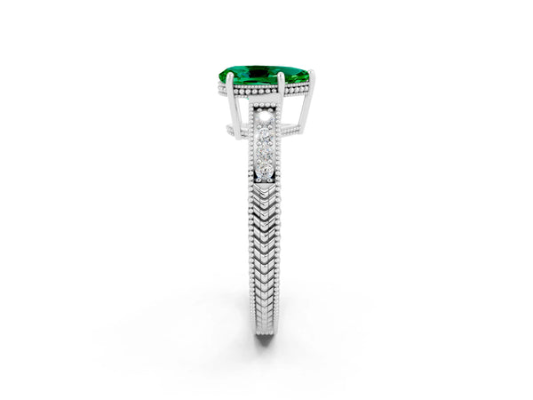 White gold Pear Cut Emerald Ring with Milgrain Pavé Band and Four-Prong Setting