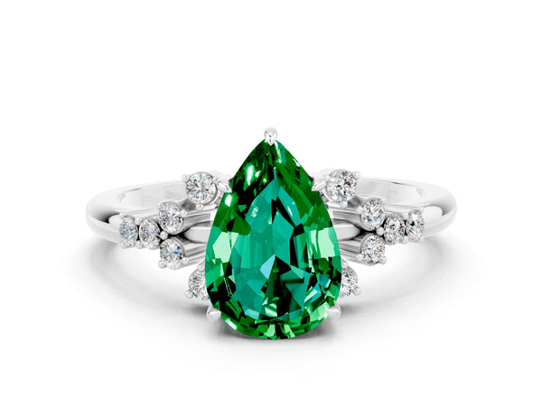 Silver Pear Cut Emerald Ring with Side Stones and Four-Prong Setting