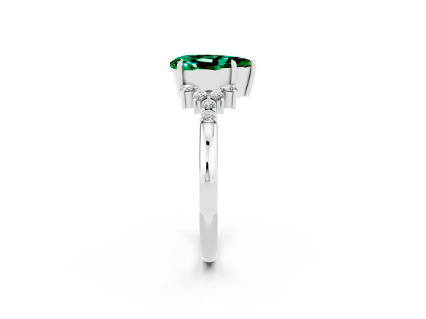 Platinum Pear Cut Emerald Ring with Side Stones and Four-Prong Setting