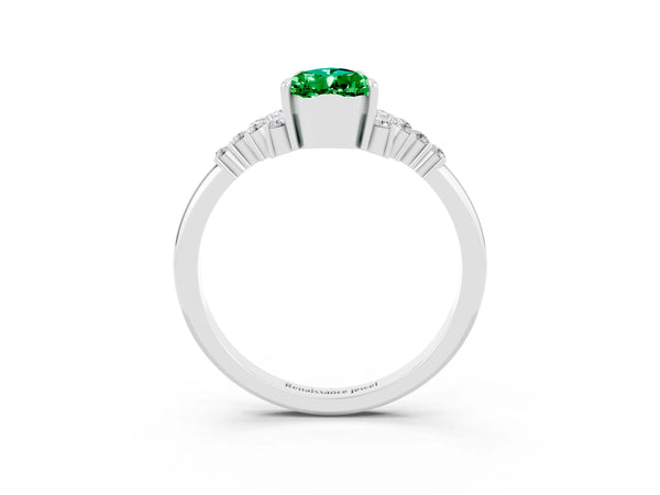 White gold Pear Cut Emerald Ring with Side Stones and Four-Prong Setting