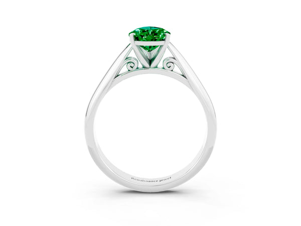 Platinum Pear Cut Emerald Solitaire Engagement Ring with Cathedral Setting and Four-Prong Mount