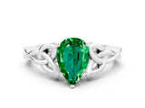 White gold Pear Cut Emerald Solitaire Engagement Ring with Celtic Knot Band and Four-Prong Setting