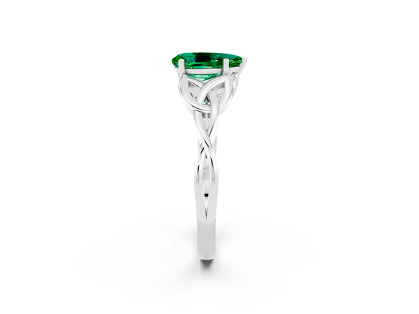 White gold Pear Cut Emerald Solitaire Engagement Ring with Celtic Knot Band and Four-Prong Setting
