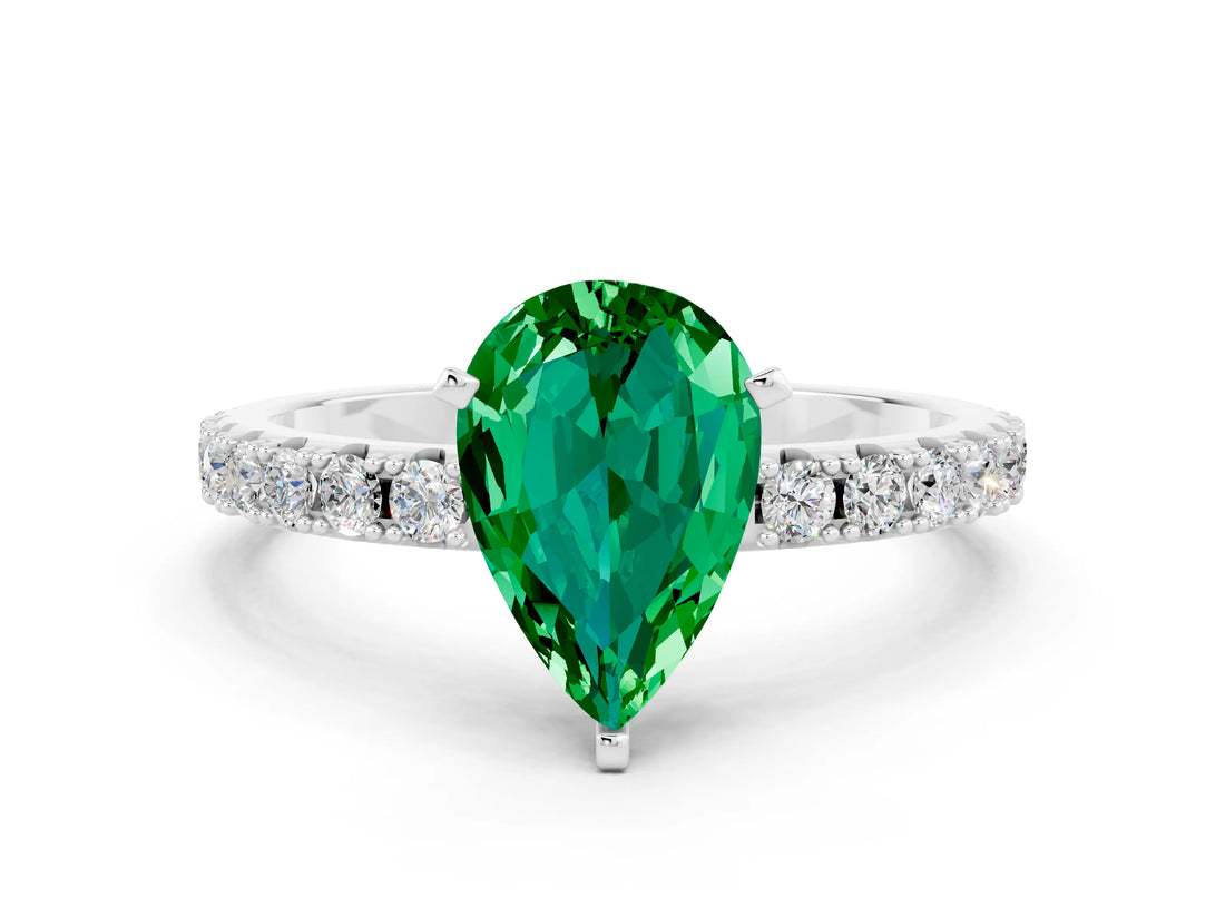White gold Pear Cut Emerald Solitaire Pavé Band with Four-Prong Setting
