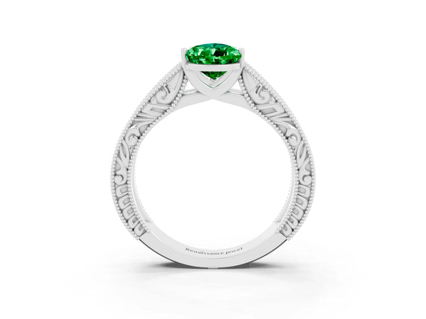 White gold Pear Cut Emerald Solitaire Ring with Engraved Band and Four-Prong Setting