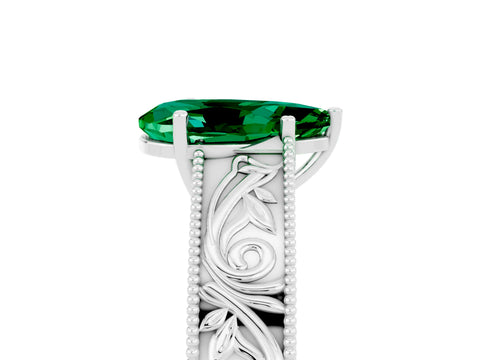 White gold Pear Cut Emerald Solitaire Ring with Engraved Band and Four-Prong Setting_5