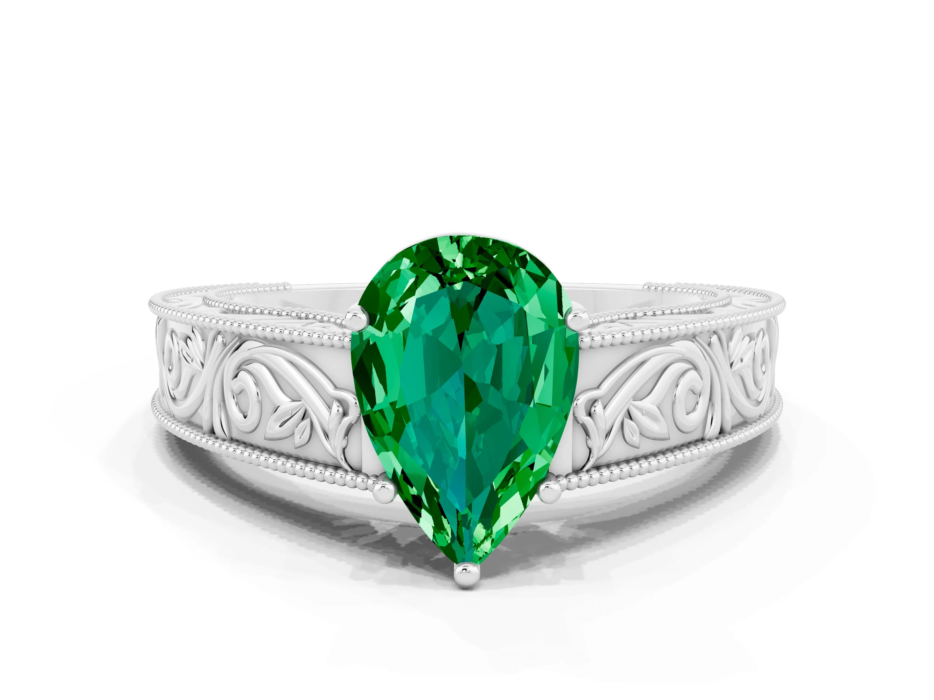 White gold Pear Cut Emerald Solitaire Ring with Engraved Band and Four-Prong Setting