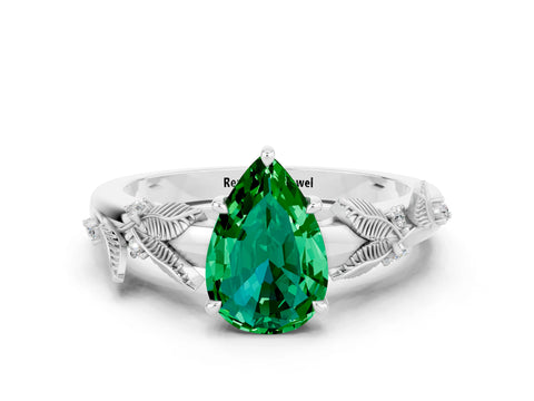 White gold Pear Cut Emerald Solitaire Ring with Leaf Motif Band and Four-Prong Setting