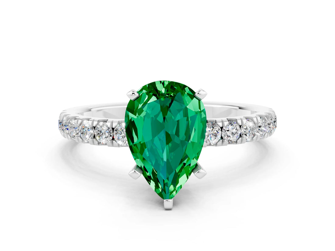 White gold Pear Cut Emerald Solitaire Ring with Pavé Accents and Four-Prong Setting