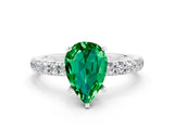 White gold Pear Cut Emerald Solitaire Ring with Pavé Accents and Four-Prong Setting