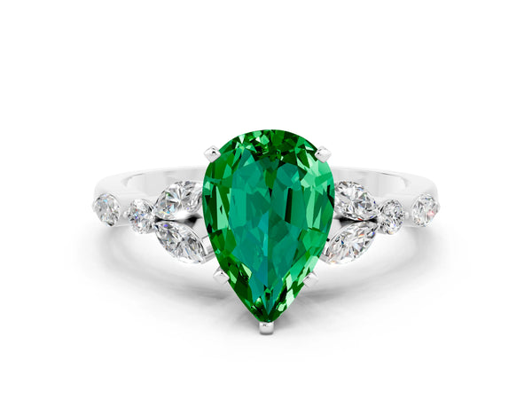 Platinum Pear Cut Emerald Solitaire Ring with Side Stones and Four-Prong Setting