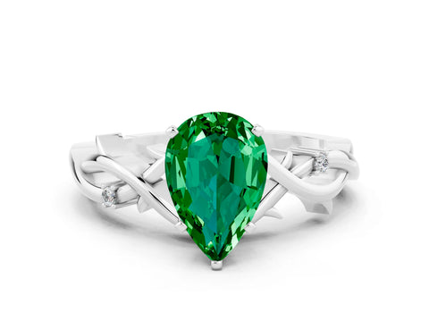 White gold Pear Cut Emerald Solitaire Ring with Twisted Band and Prong Setting