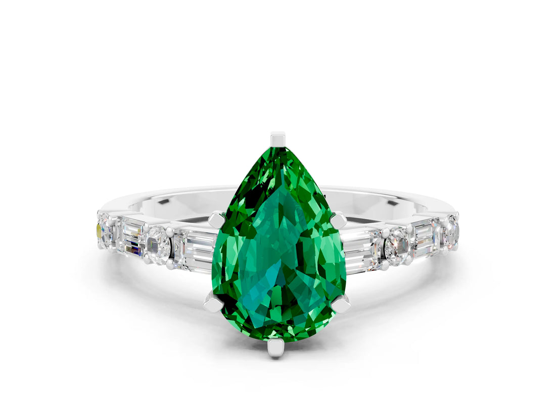 White gold Pear Cut Emerald Solitaire with Side Baguettes and Channel Set Band