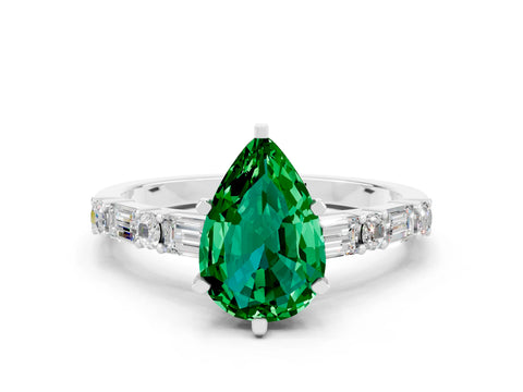 White gold Pear Cut Emerald Solitaire with Side Baguettes and Channel Set Band